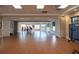 Expansive meeting room with wood floors, natural light, and neutral decor offers versatility at 515 Sawgrass Bridge Rd, Venice, FL 34292