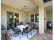 Covered patio with an outdoor dining area, perfect for enjoying the beautiful Florida weather at 515 Sawgrass Bridge Rd, Venice, FL 34292