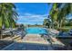 Community pool with ample lounge chairs and tropical landscaping provides a relaxing atmosphere at 515 Sawgrass Bridge Rd, Venice, FL 34292