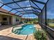 Enclosed pool area with brick patio, steps into the pool, and a water feature at 515 Sawgrass Bridge Rd, Venice, FL 34292