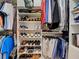 Organized walk-in closet featuring multiple shelves and hanging rods, providing ample storage at 515 Sawgrass Bridge Rd, Venice, FL 34292