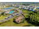 Stunning aerial view of the community featuring a pool, playground, and lush landscaping at 5222 Granite Dust Pl, Palmetto, FL 34221