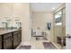 Neutral bathroom with granite counters, cabinets and storage, and combination tub and shower at 5222 Granite Dust Pl, Palmetto, FL 34221