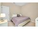 Comfortable bedroom with neutral tones, natural light, and side table at 5222 Granite Dust Pl, Palmetto, FL 34221