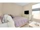 Cozy bedroom with natural light, a neutral color scheme, and ample dresser storage at 5222 Granite Dust Pl, Palmetto, FL 34221