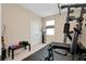 Exercise room equipped with a full exercise gym system and a window for natural light at 5222 Granite Dust Pl, Palmetto, FL 34221