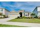 Charming single-story home featuring a two-car garage, manicured landscaping, and a well-maintained lawn at 5222 Granite Dust Pl, Palmetto, FL 34221