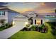 Charming single-Gathering home with lush landscaping, neutral tones, and a two-car garage at 5222 Granite Dust Pl, Palmetto, FL 34221