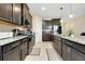 Spacious kitchen featuring granite countertops, stainless steel appliances, and dark wood cabinets at 5222 Granite Dust Pl, Palmetto, FL 34221