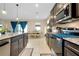 Stylish kitchen with stainless steel appliances and granite countertops, flowing into dining area at 5222 Granite Dust Pl, Palmetto, FL 34221