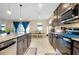 Open-concept kitchen with granite counters, stainless steel appliances, and a view to the dining area at 5222 Granite Dust Pl, Palmetto, FL 34221