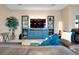 Cozy living room with entertainment center, large sectional sofa, and soft accent lighting at 5222 Granite Dust Pl, Palmetto, FL 34221