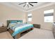 Inviting main bedroom with tray ceiling, neutral walls, and natural light at 5222 Granite Dust Pl, Palmetto, FL 34221
