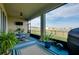 Inviting screened patio with outdoor seating and a view of the community, perfect for relaxing and entertaining at 5222 Granite Dust Pl, Palmetto, FL 34221