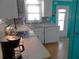 Well-equipped kitchen with bright decor and ample countertop space, ideal for preparing meals with convenience at 542 Walnut Cir, Venice, FL 34285