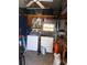 Utility room with washer, dryer, shelving and tools at 542 Walnut Cir, Venice, FL 34285