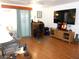 Spacious living room featuring a comfortable seating area and entertainment center, perfect for relaxation and gatherings at 542 Walnut Cir, Venice, FL 34285