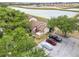 View of the townhome showcasing the trees and lakeside location in a community with ample parking at 5559 Brassy Loop, North Port, FL 34287