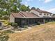 The property features a screened-in porch perfect for enjoying the outdoors while providing shade and privacy at 5559 Brassy Loop, North Port, FL 34287