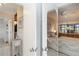 Inviting bedroom entrance with neutral tones, tiled floors, closet and hints of a waterfront view at 5559 Brassy Loop, North Port, FL 34287