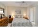 Comfortable bedroom with neutral decor, ample lighting, window view and coordinated furnishings at 5559 Brassy Loop, North Port, FL 34287