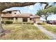 Charming townhouse featuring well-maintained landscaping and a welcoming entrance at 5559 Brassy Loop, North Port, FL 34287