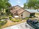 Townhouse near a lake, featuring a well-kept exterior with a cozy porch at 5559 Brassy Loop, North Port, FL 34287