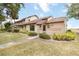 Attractive townhouse showcasing its facade and well-kept landscaping at 5559 Brassy Loop, North Port, FL 34287