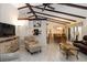 Comfortable living room with views into kitchen and dining area, featuring vaulted ceilings at 5559 Brassy Loop, North Port, FL 34287
