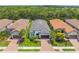 Aerial view of attractive single-Gathering homes with tile roofs, lush landscaping, and paver driveways at 5581 Piccolo St, Nokomis, FL 34275