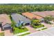 This aerial view shows beautiful homes with well-manicured lawns and tile roofs at 5581 Piccolo St, Nokomis, FL 34275