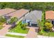 Aerial view of home in a beautiful neighborhood with tile roofs, landscaping and paver driveways at 5581 Piccolo St, Nokomis, FL 34275
