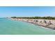 Scenic beach with clear turquoise water and sandy shores, perfect for swimming, sunbathing, and relaxation at 5581 Piccolo St, Nokomis, FL 34275