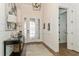 View of the foyer with gorgeous floors, an elegant front door and decorative accents at 5581 Piccolo St, Nokomis, FL 34275