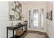 View of the foyer with gorgeous floors, an elegant front door and decorative accents at 5581 Piccolo St, Nokomis, FL 34275