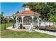 Picturesque gazebo surrounded by green grass, a tranquil retreat at 5581 Piccolo St, Nokomis, FL 34275