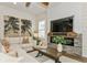 Cozy living room featuring an electric fireplace, modern decor, and comfortable seating at 5581 Piccolo St, Nokomis, FL 34275