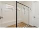 Modern shower with glass enclosure, pebble flooring, and tiled walls, offering a spa-like experience at 5581 Piccolo St, Nokomis, FL 34275