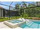 Relaxing pool with a spa, lounge chairs, and a screened enclosure amid lush landscaping at 5581 Piccolo St, Nokomis, FL 34275