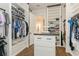 Spacious walk-in closet with custom shelving and drawers, providing ample storage and organization at 5581 Piccolo St, Nokomis, FL 34275
