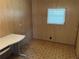 Bedroom featuring a desk and a window with blinds over carpeted floor at 5668 Holiday Park Blvd, North Port, FL 34287