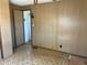 A bedroom featuring a window and door to the hallway over carpeted floor at 5668 Holiday Park Blvd, North Port, FL 34287