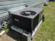The home has a modern air conditioning unit at 5668 Holiday Park Blvd, North Port, FL 34287