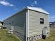Single story home with a neutral exterior and compact design in a quiet community at 5668 Holiday Park Blvd, North Port, FL 34287