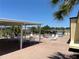 Community pool with a covered seating area and a brick paver deck at 5668 Holiday Park Blvd, North Port, FL 34287