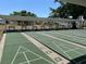 Several shuffleboard courts in an active adult community with covered benches at 5668 Holiday Park Blvd, North Port, FL 34287