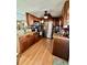 Kitchen with wood cabinets, stainless steel appliances, granite countertops, and view into the dining area at 603 Leisure, Venice, FL 34285