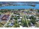 An aerial view shows the property near the bay with a private backyard and in a residential community at 607 Bay Point Ave, Nokomis, FL 34275