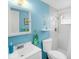 Bright bathroom with a modern vanity, shower, and seahorse decoration for a nice atmosphere at 607 Bay Point Ave, Nokomis, FL 34275