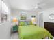 Cozy bedroom featuring a comfortable bed, bright lamps, and neutral decor at 607 Bay Point Ave, Nokomis, FL 34275